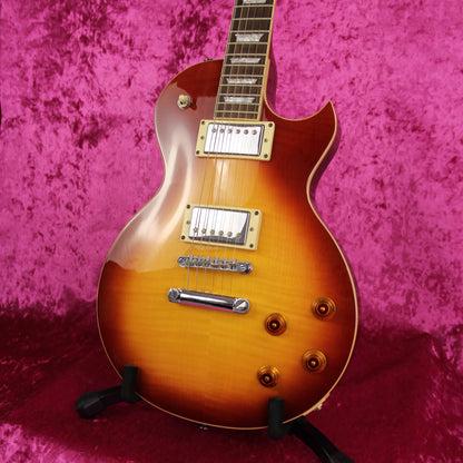 Electa Les Paul Style Electric Guitar close up image of front of instrument showing tone control knobs and sunburst design